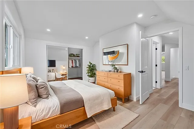 a bedroom with a bed and a dresser