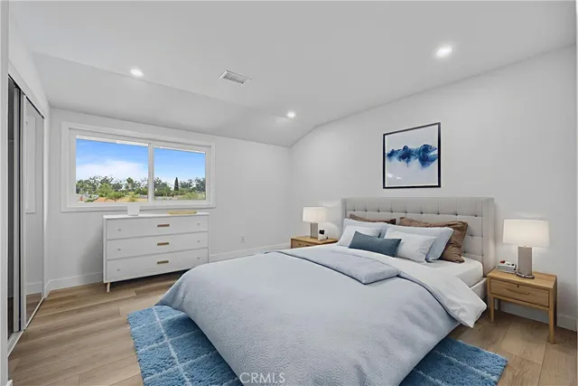 a bedroom with a bed and a dresser