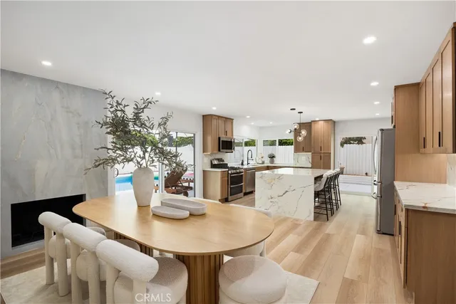 a kitchen with a table and chairs