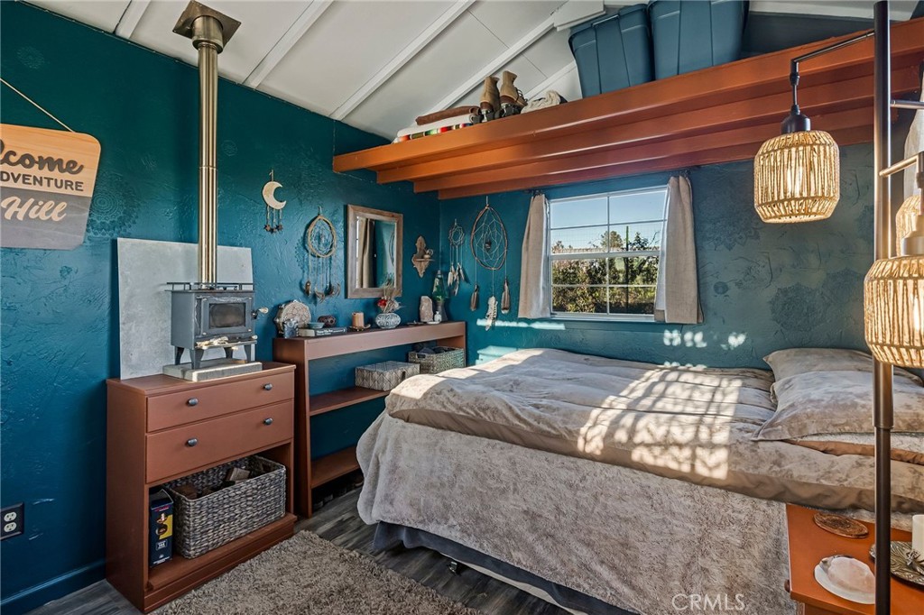 4614 Wilder Drive Chico, CA 95928 - Photo 30 of 66 One of the outbuildings being used as a bedroom with a miniature wood burning stove.