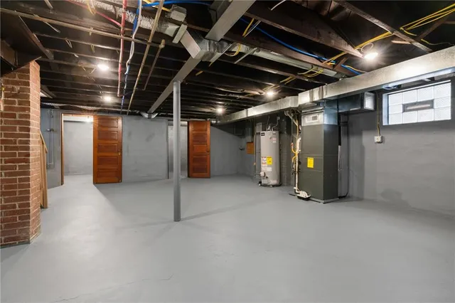 a view of empty room with refrigerator