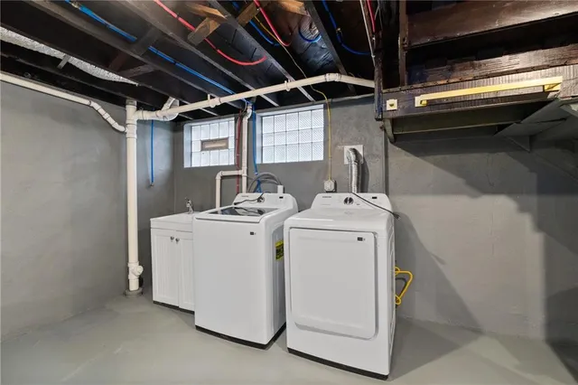a utility room with dryer and washer