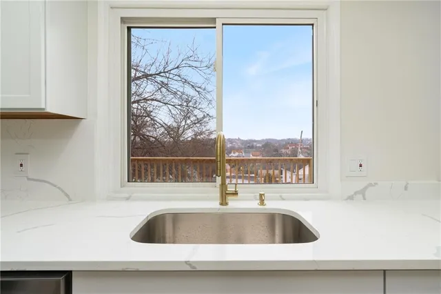 a kitchen sink with a faucet