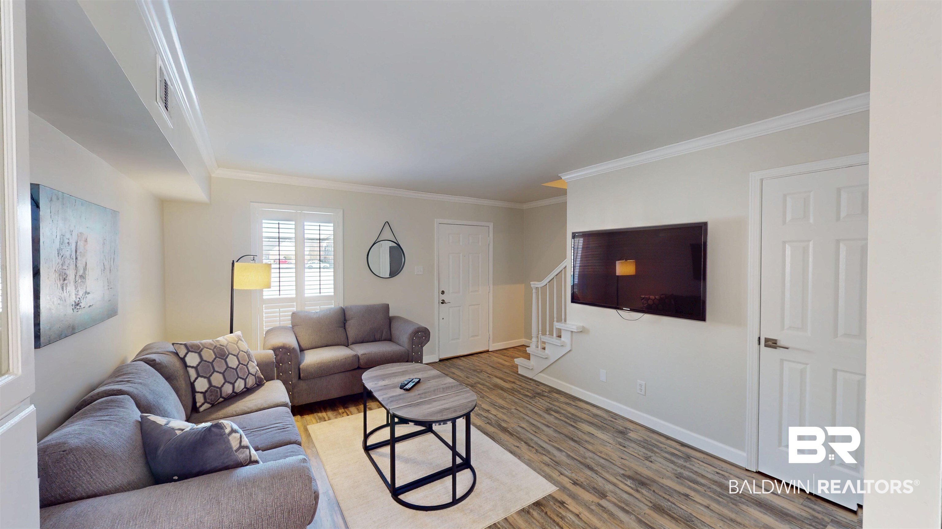 100 Du Rhu Drive, Unit J Mobile, AL 36608 - Photo 9 of 17 Living area with light wood finished floors and crown molding
