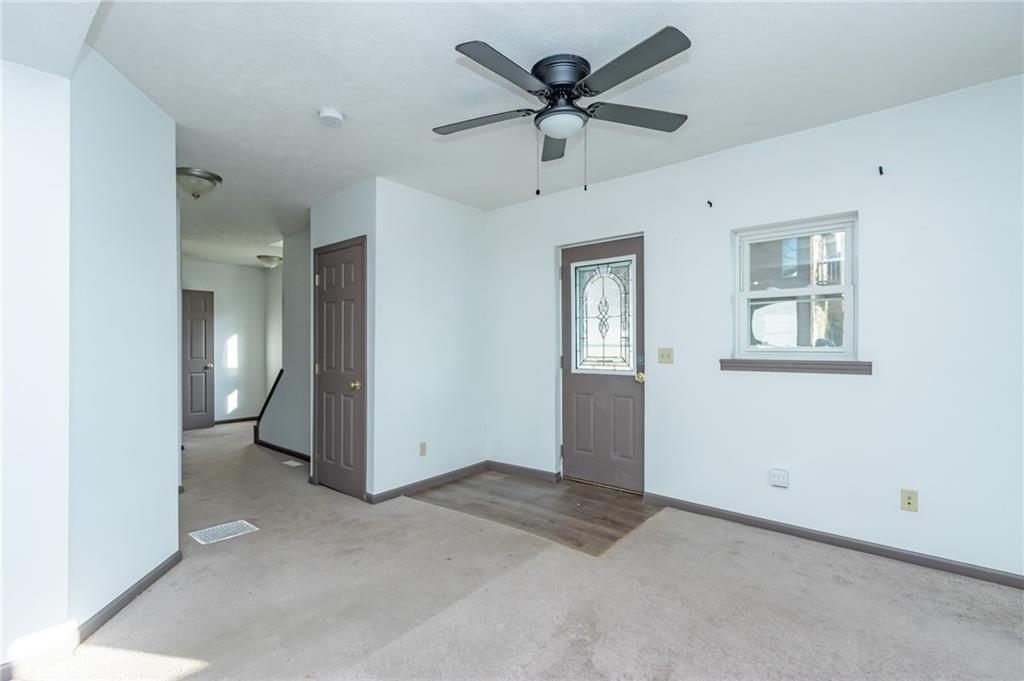 400 West Fulton Street Butler, PA 16001 - Photo 12 of 22 a view of a big room with wooden floor and windows