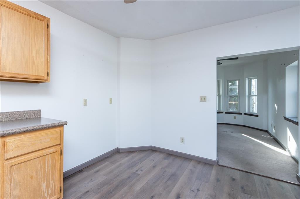 400 West Fulton Street Butler, PA 16001 - Photo 16 of 22 an empty room with wooden floor and a window