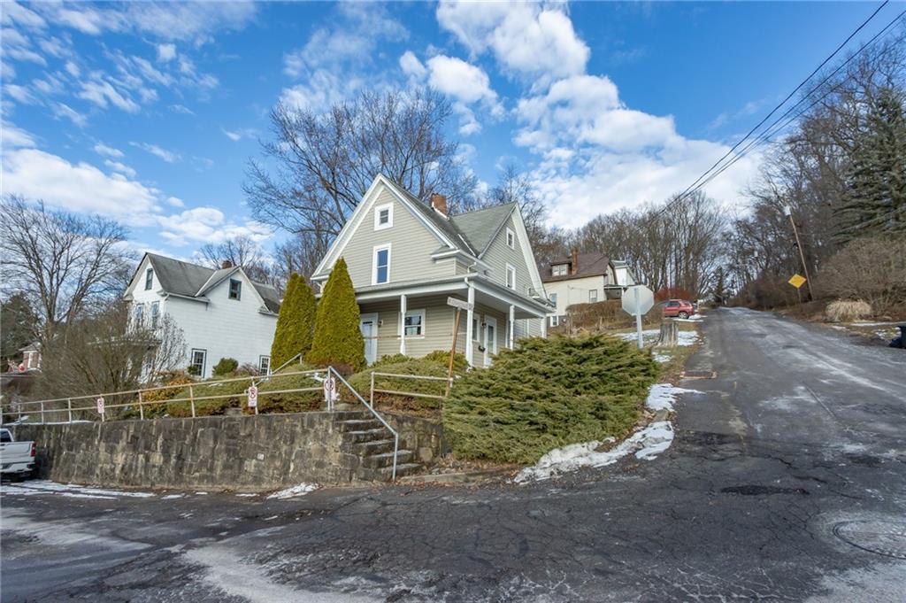 400 West Fulton Street Butler, PA 16001 - Photo 2 of 22 a front view of a house with garden