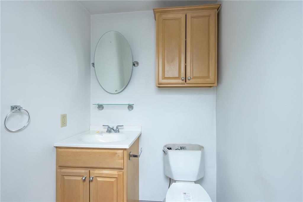 400 West Fulton Street Butler, PA 16001 - Photo 21 of 22 a bathroom with a toilet sink and mirror