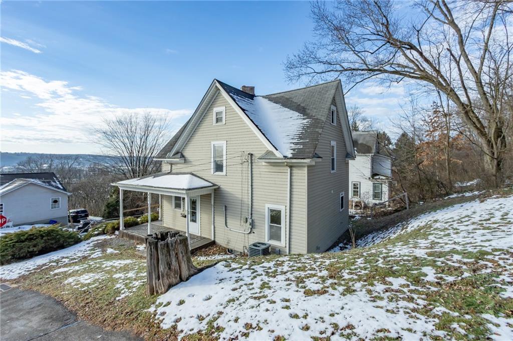 400 West Fulton Street Butler, PA 16001 - Photo 4 of 22 a front view of a house with a yard and garage
