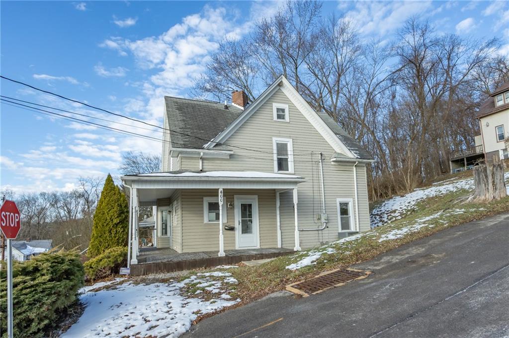 400 West Fulton Street Butler, PA 16001 - Photo 5 of 22 a front view of a house with a yard and garage