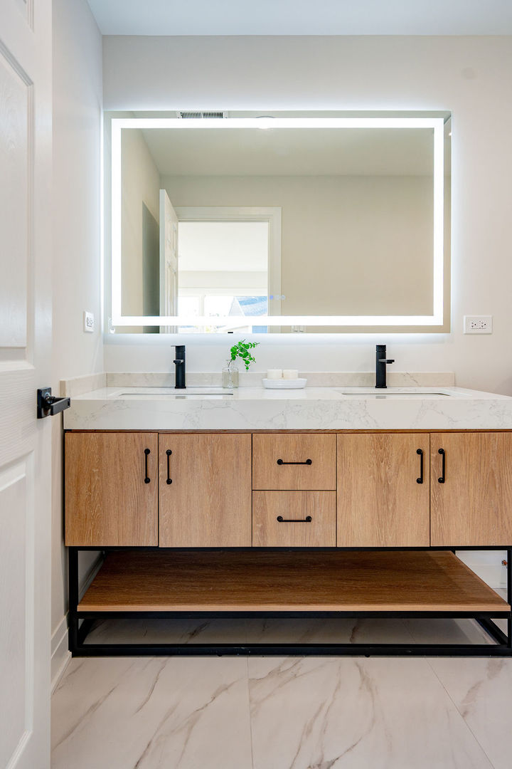 6964 West Cleveland Street Niles, IL 60714 - Photo 16 of 25 a bathroom with a sink and a mirror