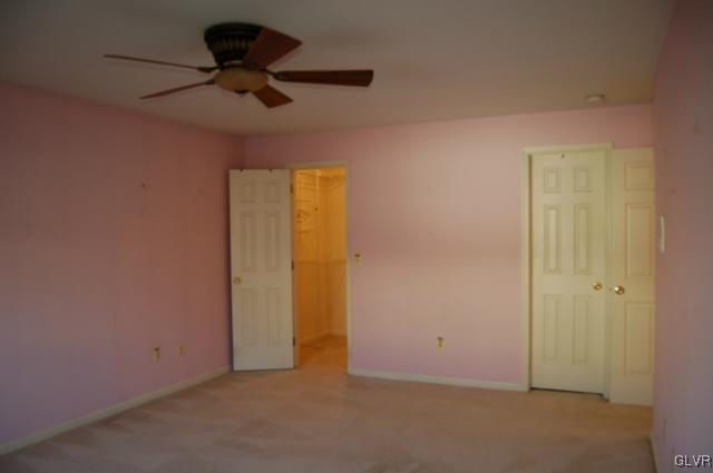 853 Cold Spring Road, Unit 6 Allentown, PA 18103 - Photo 12 of 23 an empty room with a ceiling fan and a window