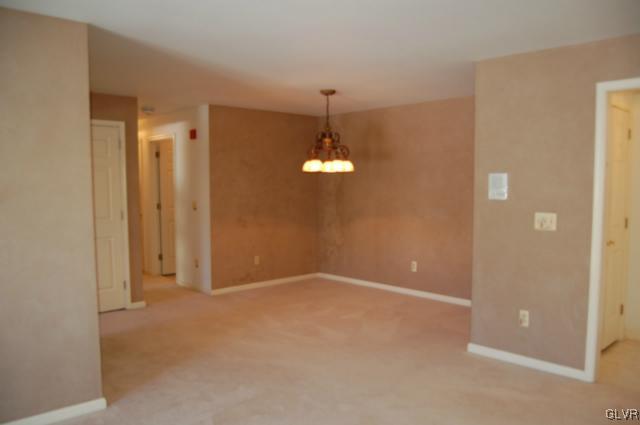 853 Cold Spring Road, Unit 6 Allentown, PA 18103 - Photo 7 of 23 a view of an empty room with chandelier fan