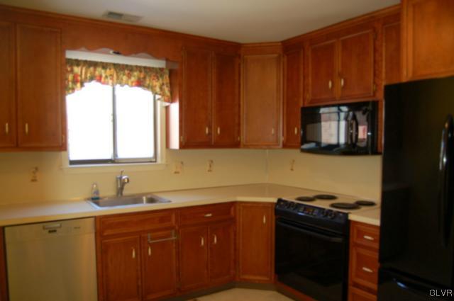 853 Cold Spring Road, Unit 6 Allentown, PA 18103 - Photo 8 of 23 a kitchen with granite countertop cabinets stainless steel appliances and a window