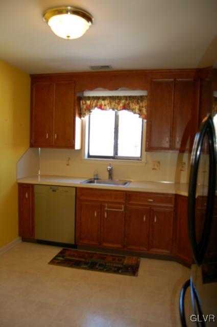 853 Cold Spring Road, Unit 6 Allentown, PA 18103 - Photo 9 of 23 a room with granite countertop cabinets washer and dryer