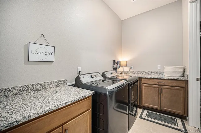 a large bed sitting in a bedroom next to a window