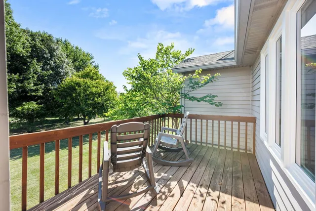 a view of balcony with wooden floor