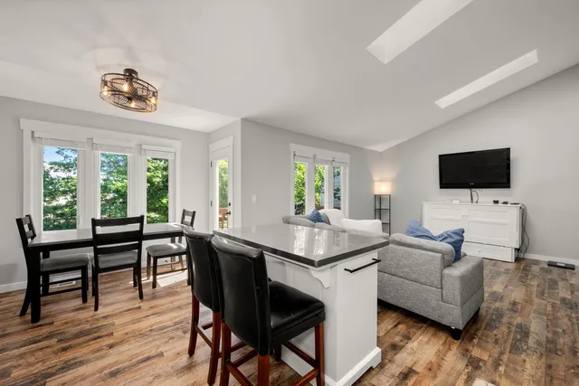 a view of a livingroom with furniture and a window
