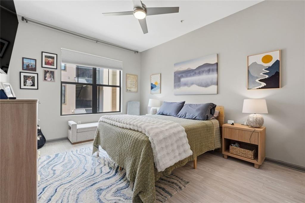 5300 Peachtree Road, Unit 2604 Atlanta, GA 30341 - Photo 17 of 39 a bedroom with a bed and a painting on the wall