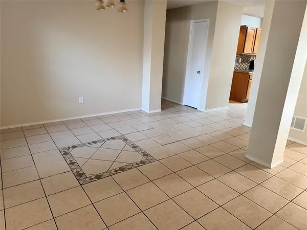 a view of a livingroom and window