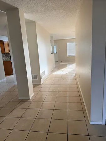 a view of entryway with kitchen