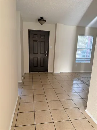 a view of a livingroom with an empty space and a sink