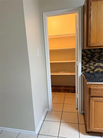 a view of a closet and a window