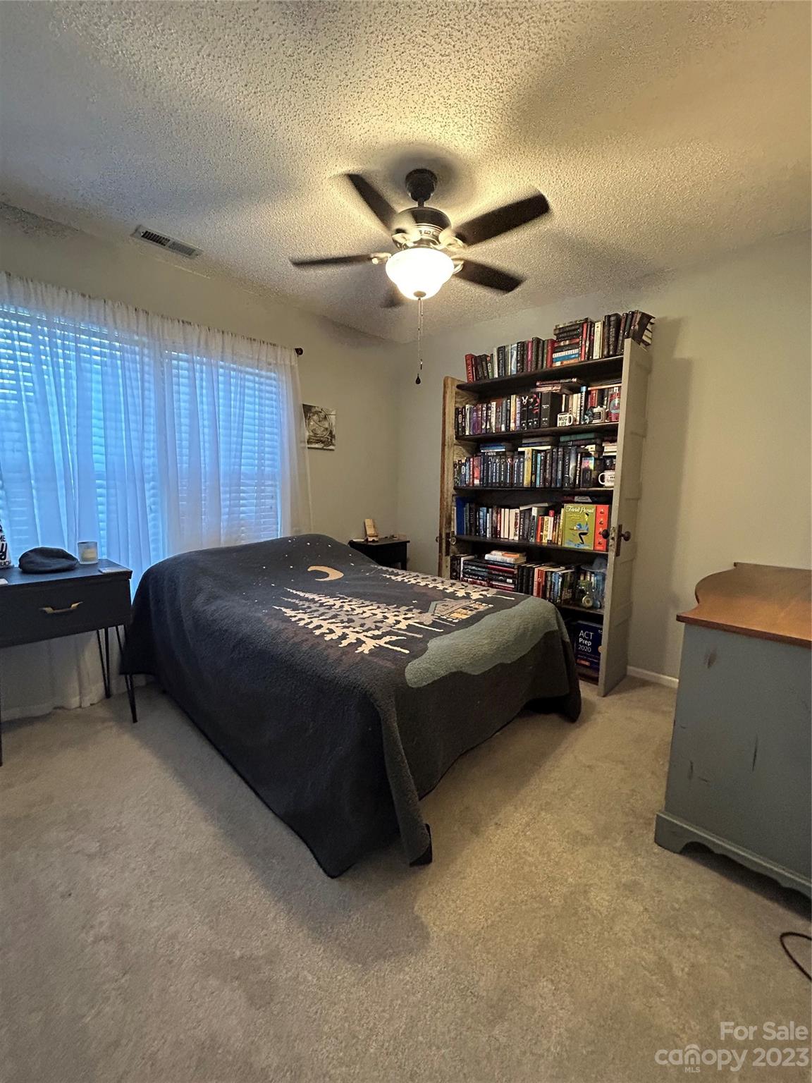 160 Hunters Pointe Drive Dallas, NC 28034 - Photo 15 of 31 a bedroom with a bed and a ceiling fan