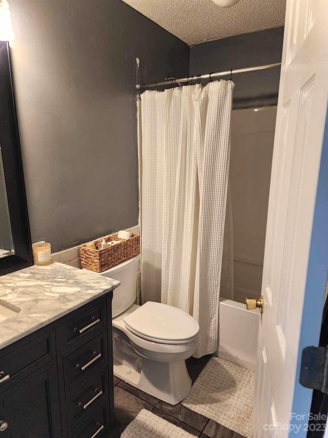 160 Hunters Pointe Drive Dallas, NC 28034 - Photo 16 of 31 a bathroom with a granite countertop sink toilet and shower