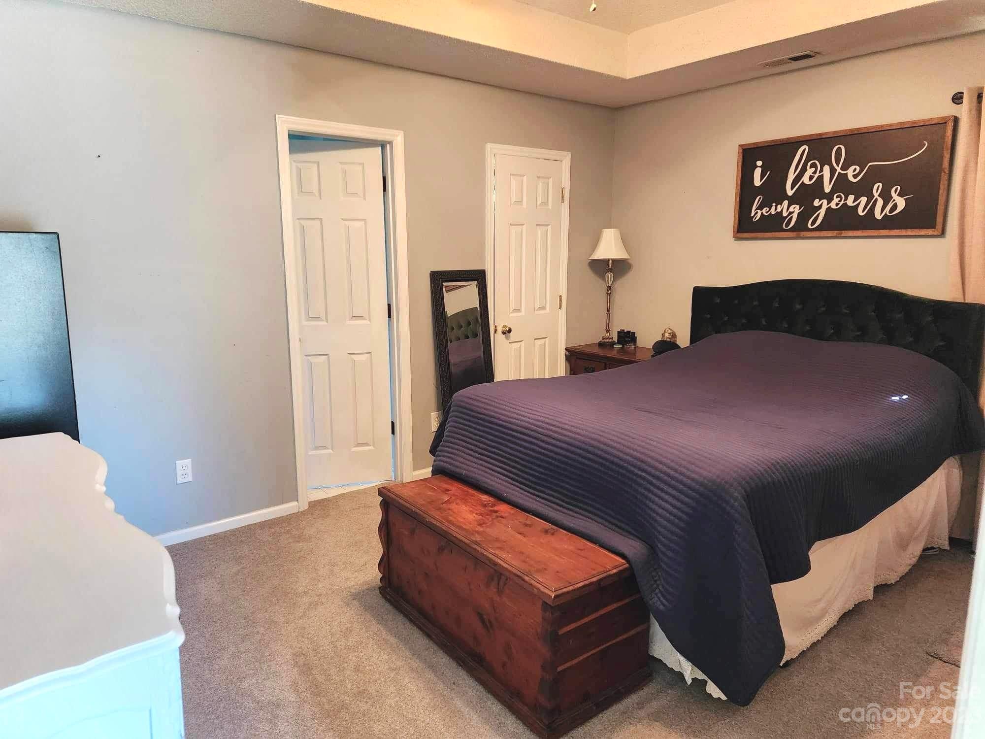 160 Hunters Pointe Drive Dallas, NC 28034 - Photo 21 of 31 a bedroom with a bed and window