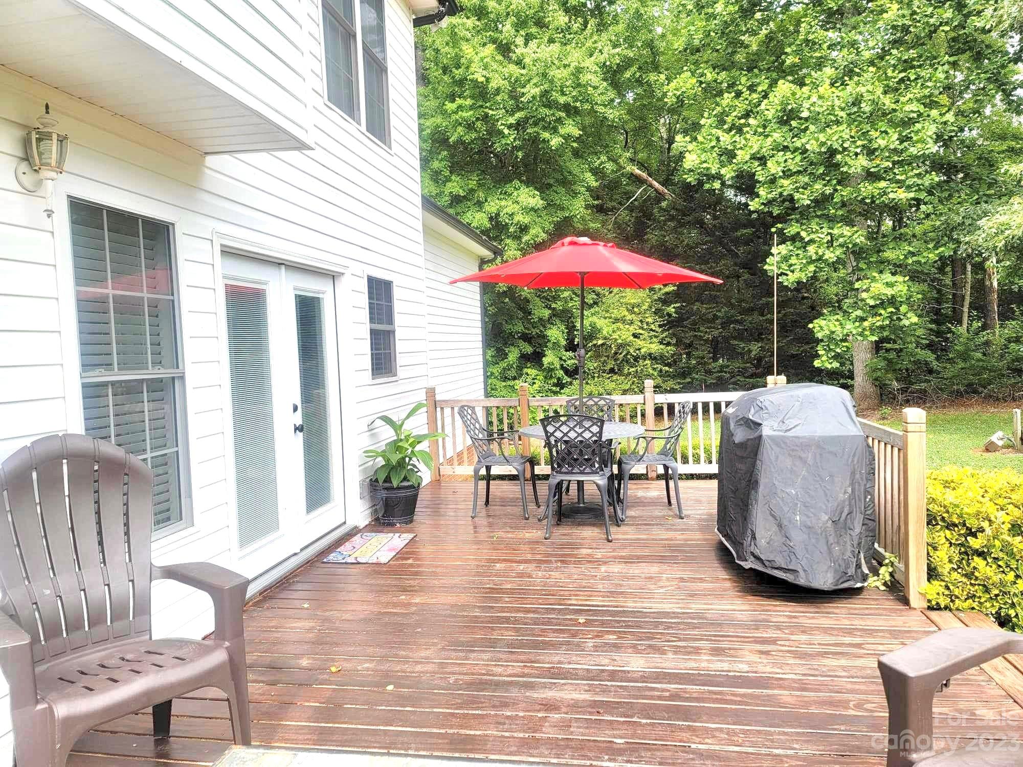 160 Hunters Pointe Drive Dallas, NC 28034 - Photo 25 of 31 a view of a patio with a table and chairs
