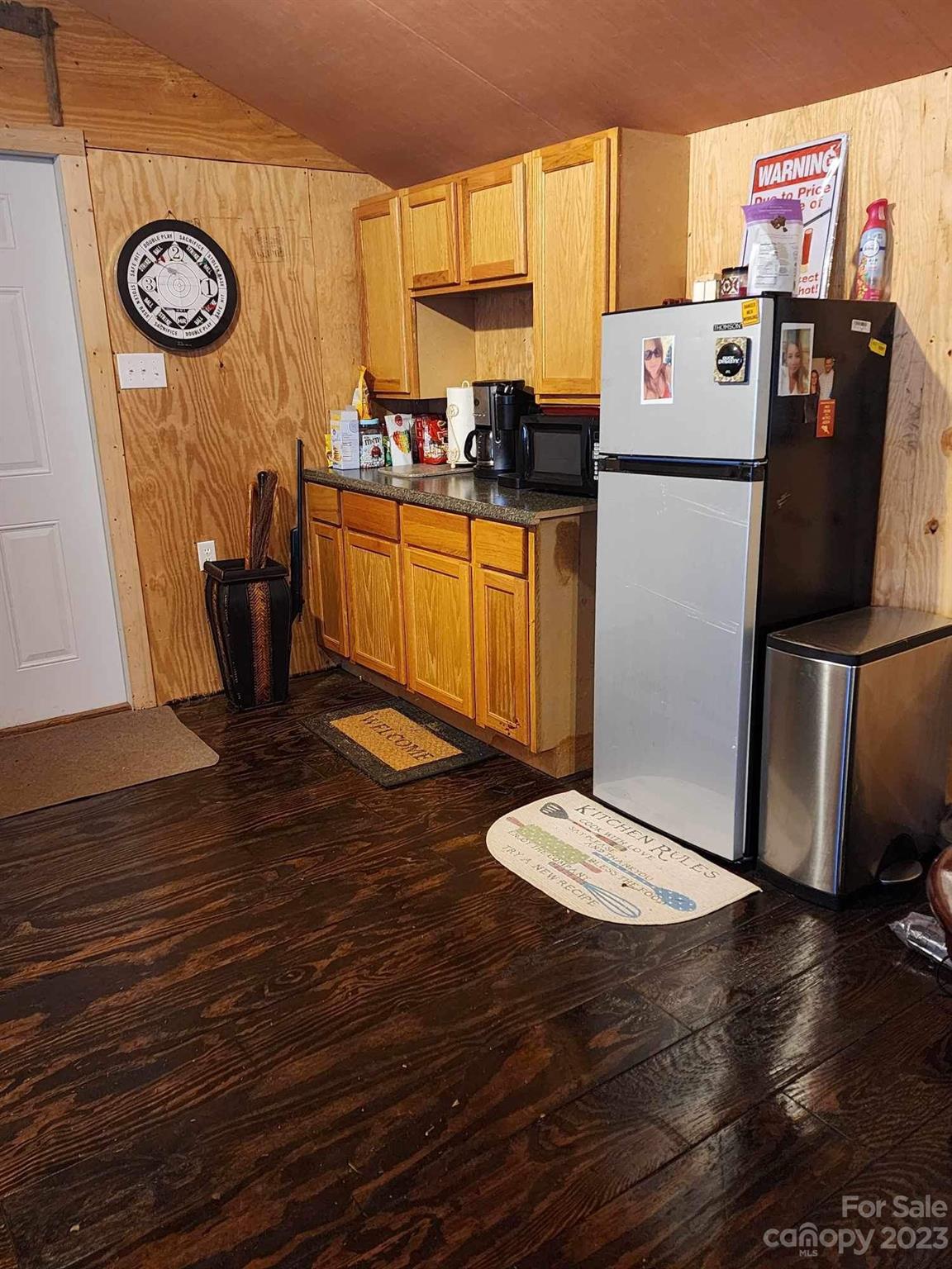 160 Hunters Pointe Drive Dallas, NC 28034 - Photo 28 of 31 a kitchen with a refrigerator and wooden floor
