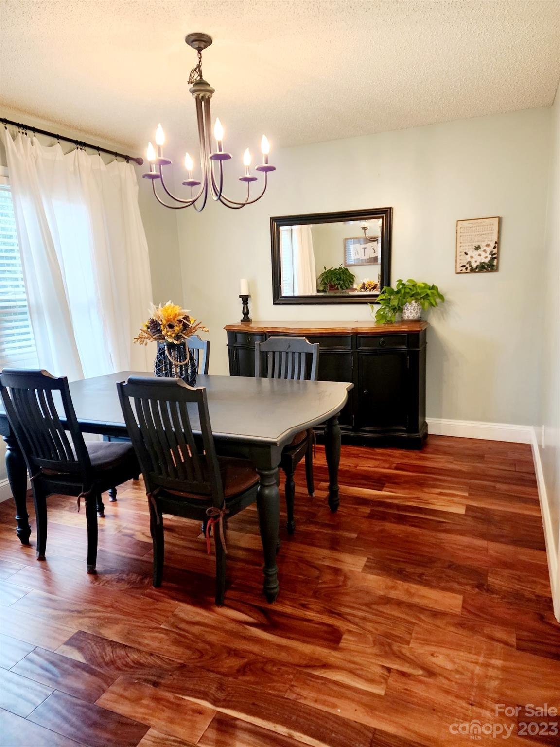 160 Hunters Pointe Drive Dallas, NC 28034 - Photo 4 of 31 a view of a dining room with furniture and wooden floor
