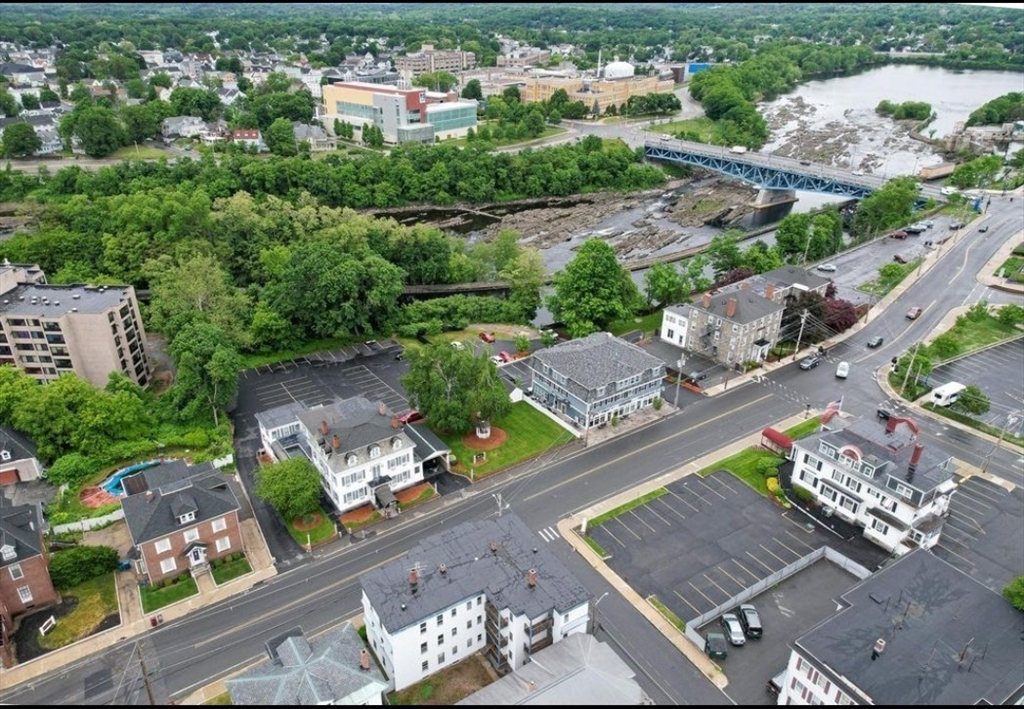 304 Pawtucket Street, Unit 2 Lowell, MA 01854 - Photo 4 of 16 an aerial view of a city with lots of residential buildings