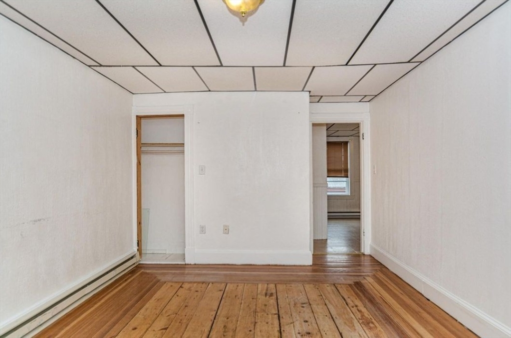 304 Pawtucket Street, Unit 2 Lowell, MA 01854 - Photo 9 of 16 a view of a room with wooden floor