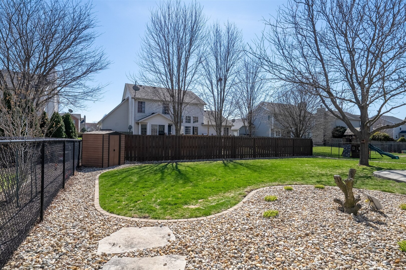 3291 Red Jasper Street Normal, IL 61761 - Photo 12 of 48 a view of a backyard with a garden