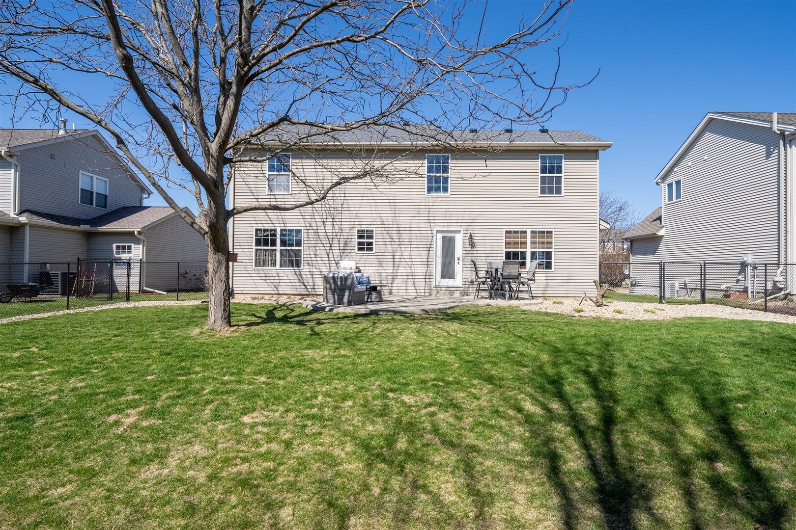 3291 Red Jasper Street Normal, IL 61761 - Photo 15 of 48 a view of a house with a backyard porch and sitting area