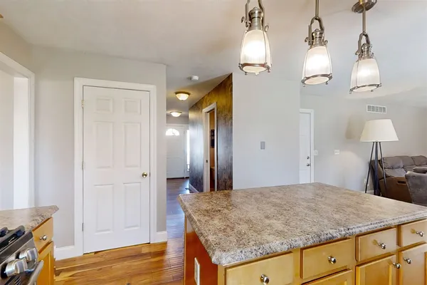 a view of a kitchen cabinets and wooden floor