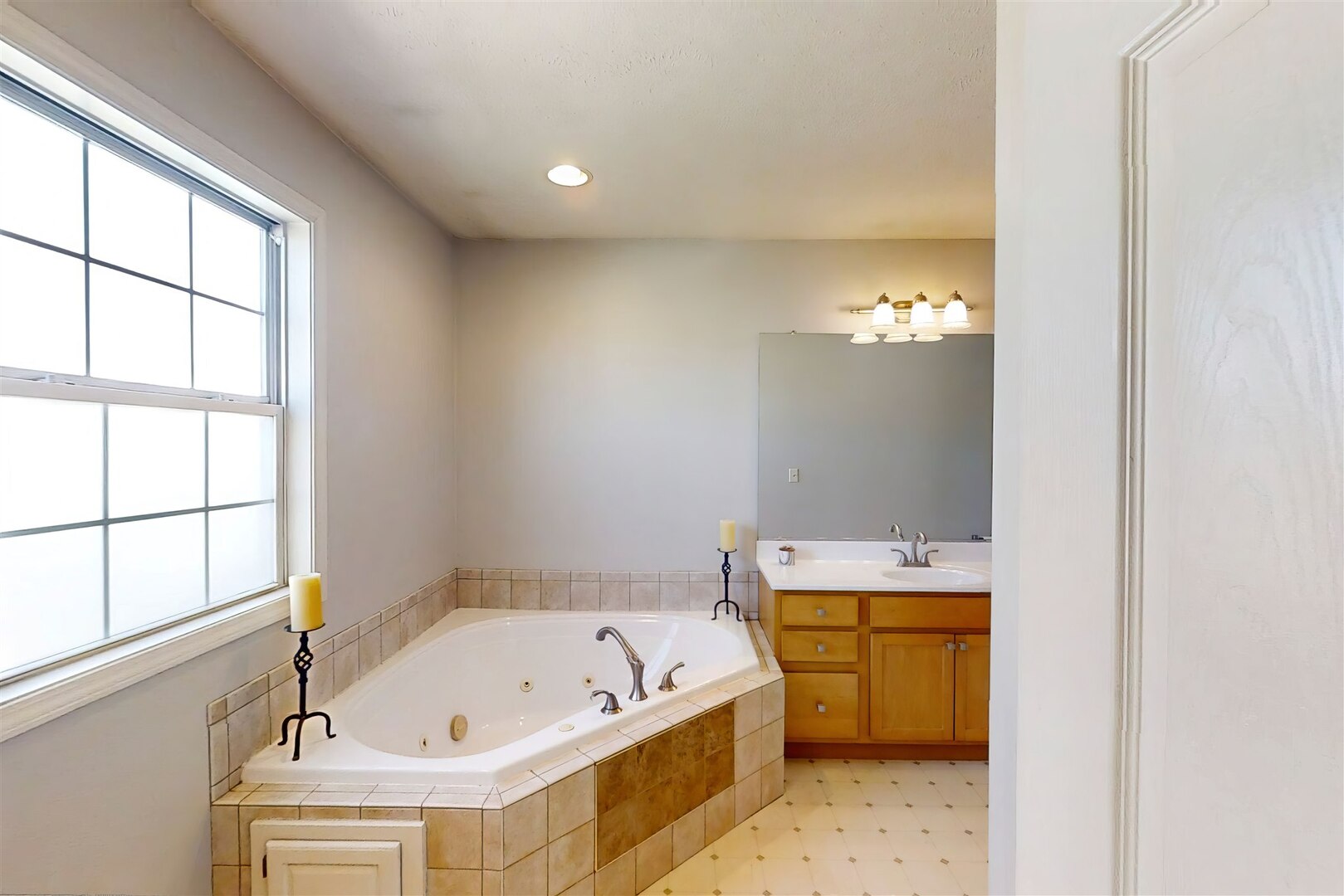 3291 Red Jasper Street Normal, IL 61761 - Photo 32 of 48 a bathroom with a tub a sink and a window