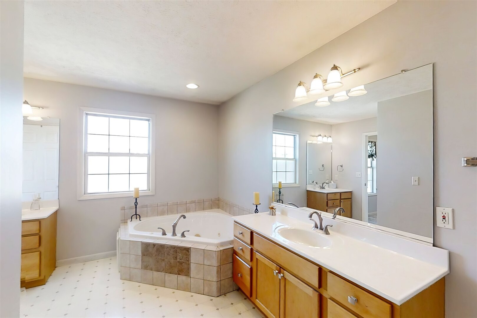 3291 Red Jasper Street Normal, IL 61761 - Photo 35 of 48 a bathroom with a tub sink and mirror