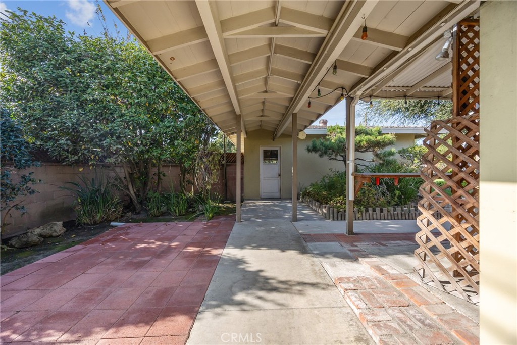 10357 Lesterford Avenue Downey, CA 90241 - Photo 24 of 31 The covered walkway to the garage at 10357 Lesterford Avenue