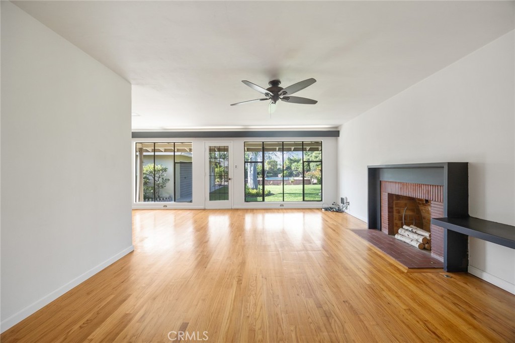 10357 Lesterford Avenue Downey, CA 90241 - Photo 4 of 31 The spacious living room at 10357 Lesterford Drive has a gas burning fireplace in the living room.