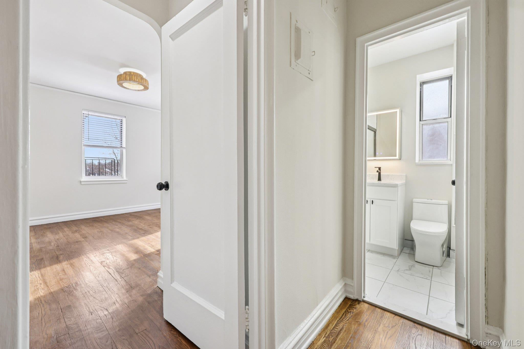 1 Bronxville Road, Unit 3S Bronxville, NY 10708 - Photo 20 of 27 Hall with dark wood-style flooring and healthy amount of natural light