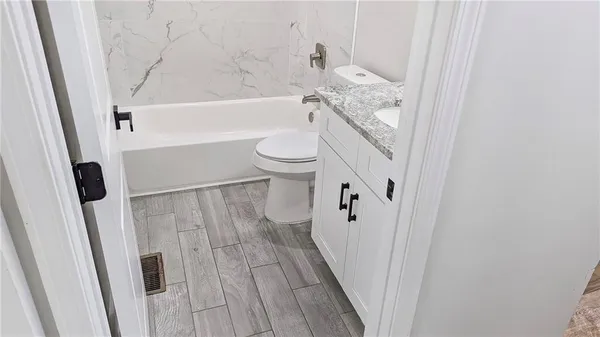 a bathroom with a sink and toilet