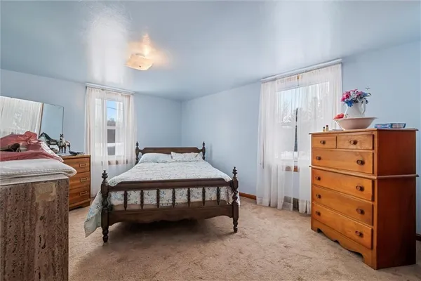 a bedroom with a bed and a cabinets