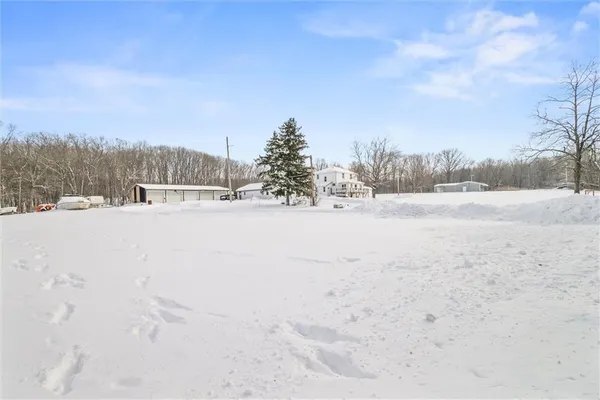 a view of snow on the road