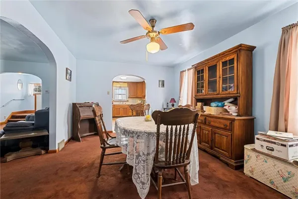 a living room with furniture and windows