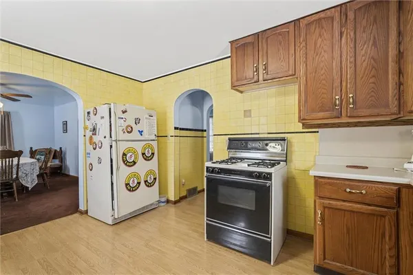 a kitchen with sink cabinets and dining table