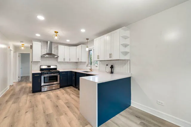 a kitchen with granite countertop a sink and cabinets