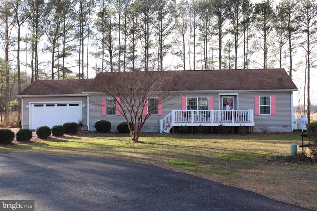 a view of a house with swimming pool and a yard